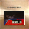 Jan Garbarek Photo With Blue Sky, White Cloud, Wires, Windows And A Red Roof